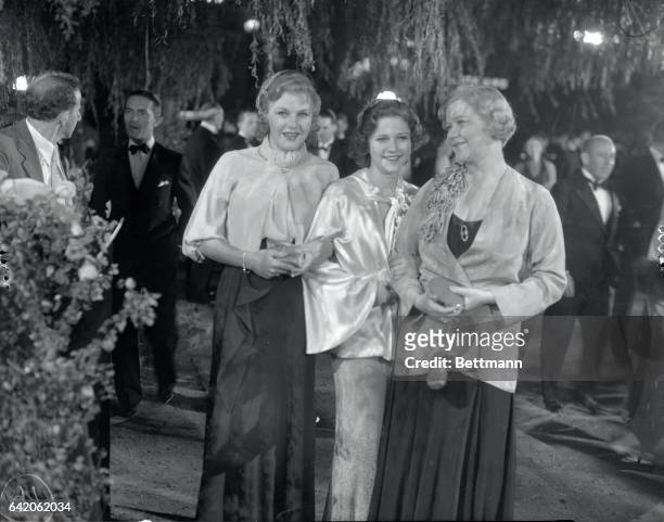 Ginger Rogers popular musical comedy and screen star, with Phyllis Fraser, and Ginger's mother, Mrs. Rogers, as they appeared at the recent opening...