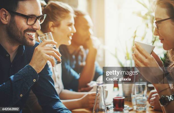 good times at a restaurant. - toned image stock pictures, royalty-free photos & images