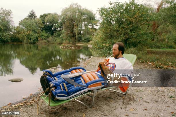 Goalie Billy Smith of the New York Islanders poses for a portrait near a lake in October, 1983 in Woodbury, New York.