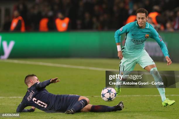 Neymar of Barcelona FC in action with Marco Verrati of PSG during the UEFA Champions League Round of 16 first leg match between Paris Saint-Germain...