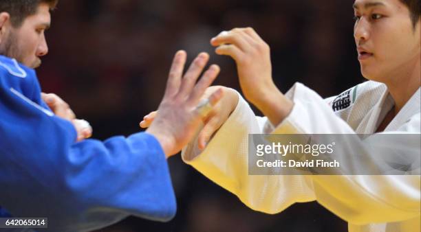 Eighteen year old, Kentaro Iida of Japan throws Olympic bronze medallist, Cyrille Maret of France for a wazari to win the u100kg final and the gold...