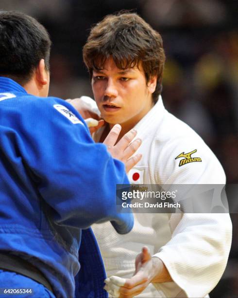 Double world silver medallist, Ryu Shichinohe of Japan , tries to grip Takeshi Ojitani, also of Japan. Ojitani won the heavyweight gold medal after...