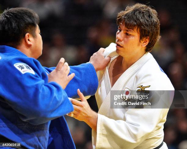 Double world silver medallist, Ryu Shichinohe of Japan , tries to grip Takeshi Ojitani, also of Japan. Ojitani won the heavyweight gold medal after...