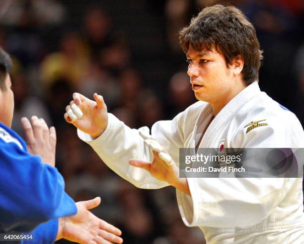 Double world silver medallist, Ryu Shichinohe of Japan , tries to grip Takeshi Ojitani, also of Japan. Ojitani won the heavyweight gold medal after...