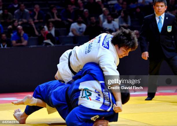 Ryu Shichinohe of Japan throws Takeshi Ojitani, also of Japan without a score. Ojitani won the heavyweight gold medal after Shichinohe was...