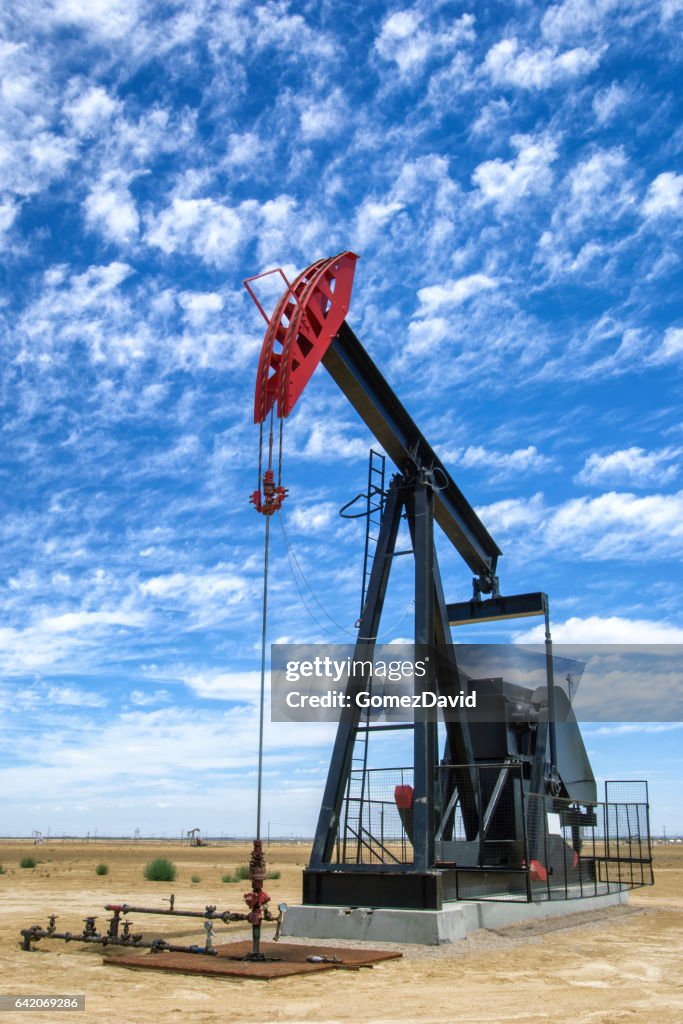 Oil Pumpjack with Clouds in Background