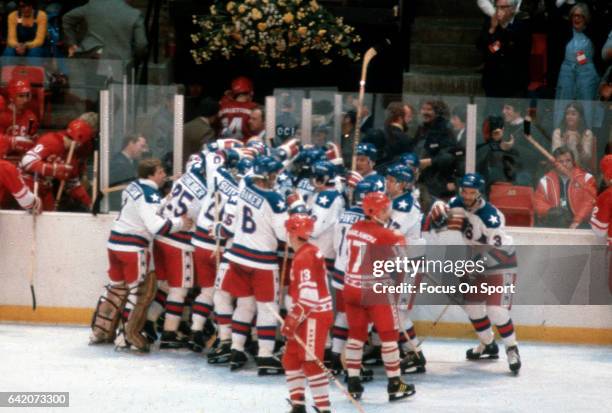 The United States Hockey team celebrates after they defeated the Soviet Union during a metal round game of the Winter Olympics February 22, 1980 at...