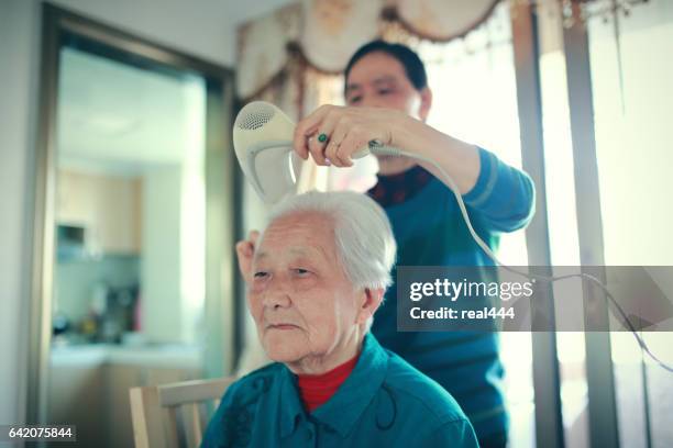happy asian family - drying hair stock pictures, royalty-free photos & images