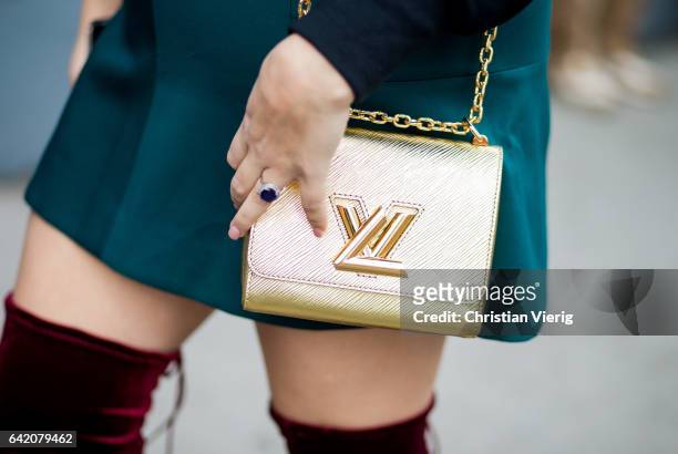 Golden Louis Vuitton bag outside Delpozo on February 15, 2017 in New York City.