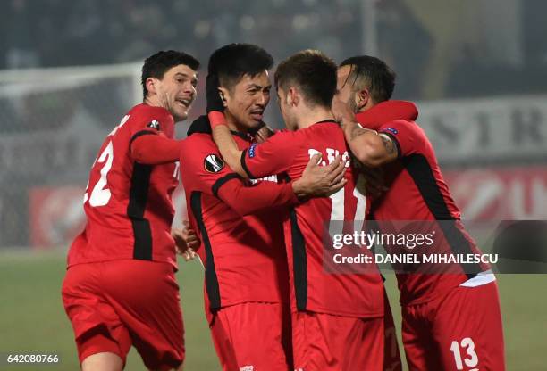 Takayuki Seto of Astra Giurgiu celebrates after he scored 2-2 during the UEFA Europa League round of 32 first-leg football match between FC Astra and...