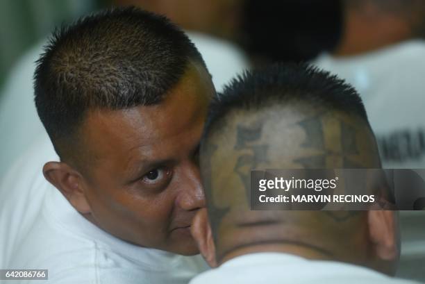 Former 18th Street gang members attend a class on biblical education at the San Francisco Gotera prison, 165 km from San Salvador, on February 16,...