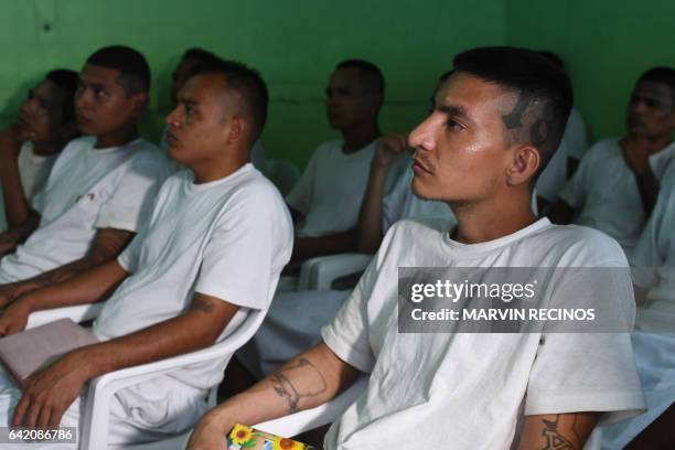 Former 18th Street gang members attend a class on biblical education at the San Francisco Gotera prison, 165 km from San Salvador, on February 16,...