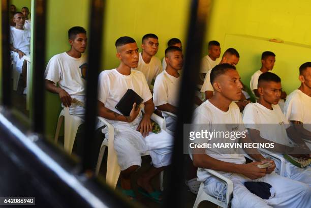 Former 18th Street gang members attend a class on biblical education at the San Francisco Gotera prison, 165 km from San Salvador, on February 16,...