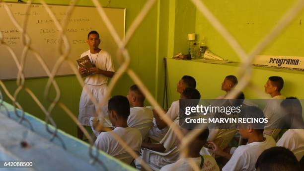 Former 18th Street gang members attend a class on biblical education at the San Francisco Gotera prison, 165 km from San Salvador, on February 16,...