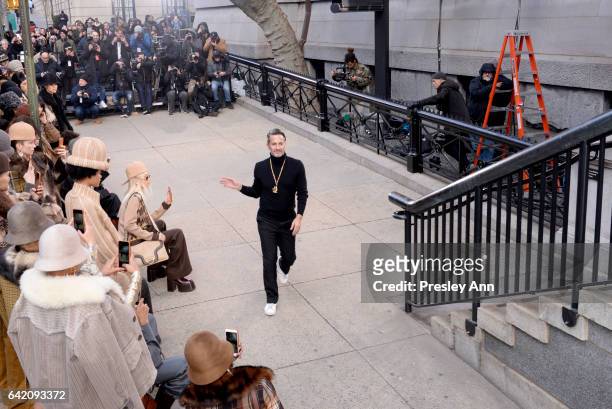 Designer Marc Jacobs greet his models on the outside runway at the Marc Jacobs Fall 2017 Show at Park Avenue Armory on February 16, 2017 in New York...