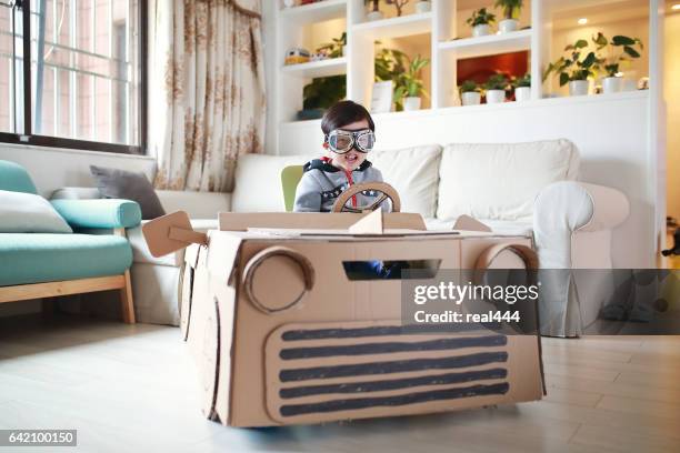 children play in the cardboard car - boy kid playing cars stock pictures, royalty-free photos & images