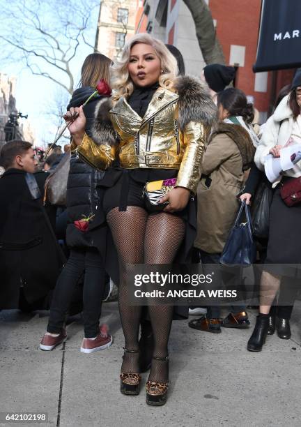 Rapper Lil' Kim poses during the Marc Jacobs collection during New York Fashion Week on February 16 in New York City. / AFP / Angela Weiss