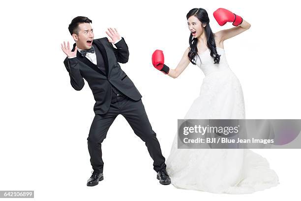 humorous bride and groom - angry groom wedding photos et images de collection