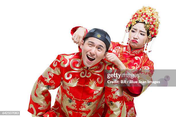 humorous bride and groom - angry groom wedding photos et images de collection