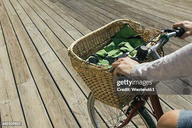 young woman riding bicycle with basket, close up - handlebar stock pictures, royalty-free photos & images