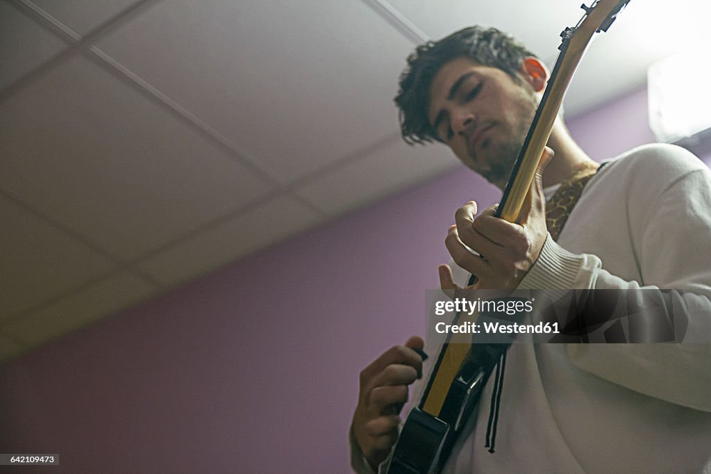 Guitar player rehearsing for performance