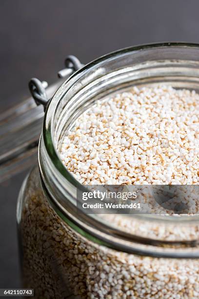 jar of popped amarant, close-up - amarant stock pictures, royalty-free photos & images