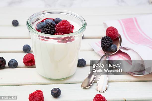 glass of greek yogurt with berries - yogurt stock pictures, royalty-free photos & images