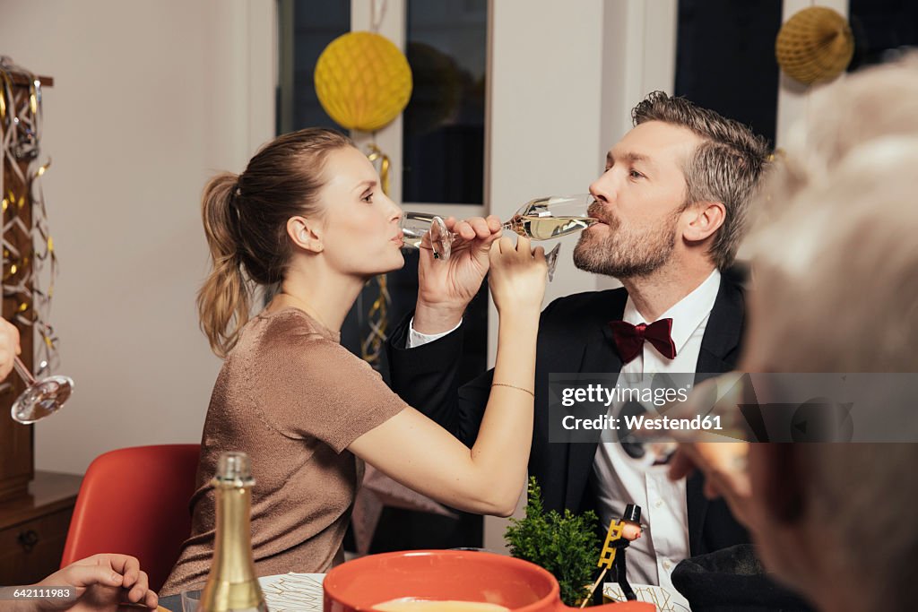 Couple drinking to close friendship on New Year's Eve