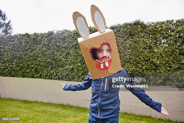 boy wearing bunny mask in garden - funny easter bildbanksfoton och bilder