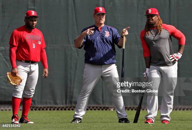 Boston Red Sox third baseman Pablo Sandoval, Boston Red Sox manager John Farrell, and Boston Red Sox first baseman Hanley Ramirez are pictured during...