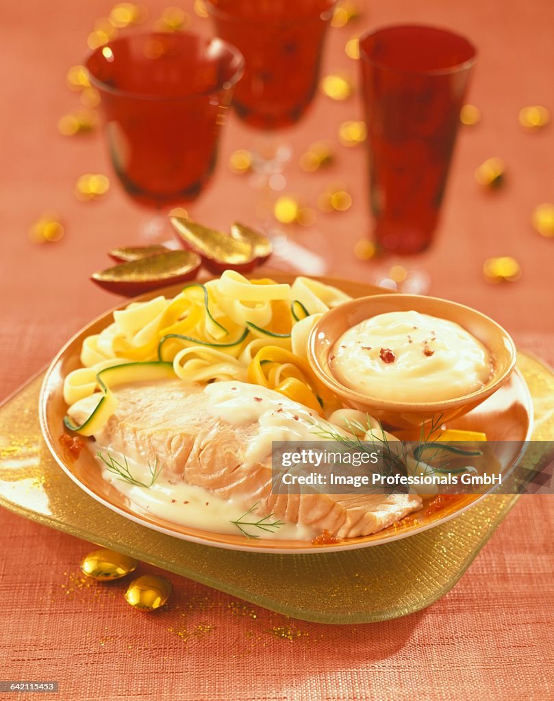 Salmon steak in white butter sauce