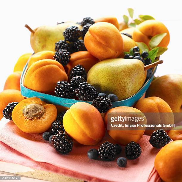 basket of summer fruits - cassis fruit stock-fotos und bilder
