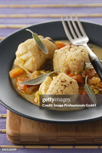 monkfish mdaillon with tomato and herb stock - anglerfish stock pictures, royalty-free photos & images