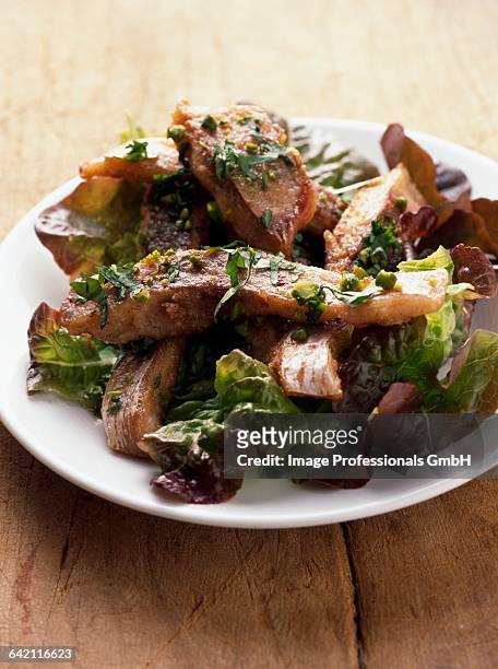 pan-fried carp and pistachio salad - lattuga stock pictures, royalty-free photos & images