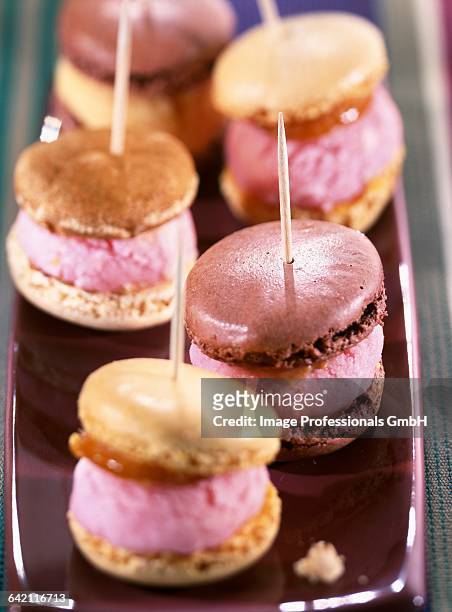 macaroons filled with sorbet - macarons roses stock pictures, royalty-free photos & images