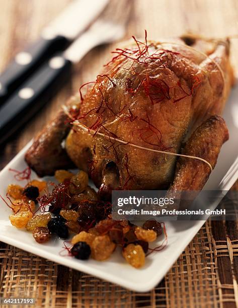 roast pigeon with almonds - roast pigeon stock pictures, royalty-free photos & images