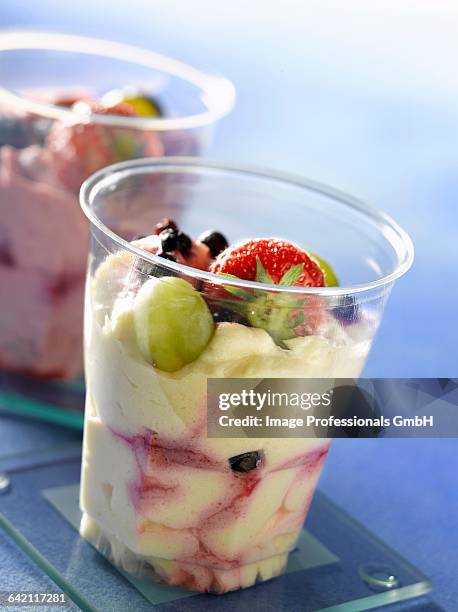 passionfruit and blackcurrant mousse verrine - cassis fruit stock-fotos und bilder