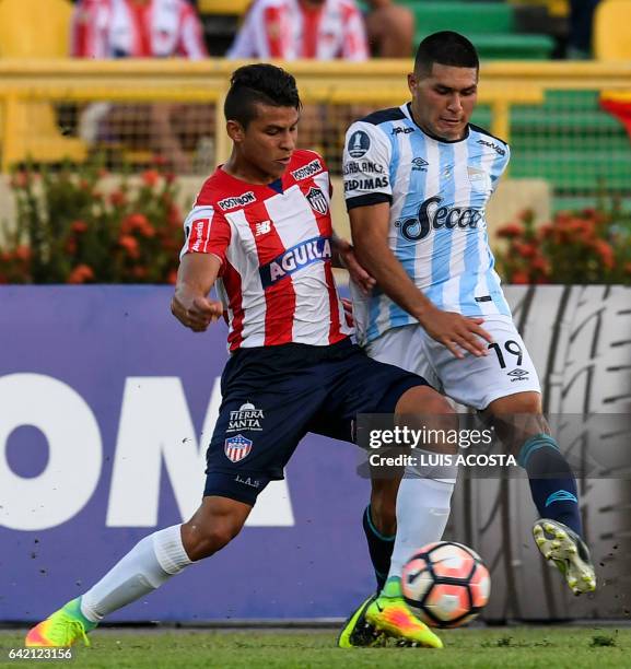 Colombia's Junior player Alexis Perez vies for the ball with Argentina's Atletico Tucuman player David Barbona during their Copa Libertadores 2017...