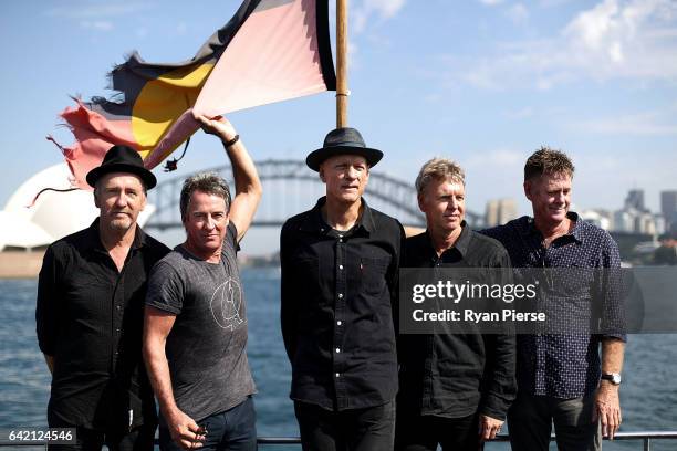 Bones Hillman, Rob Hirst, Peter Garrett, Jim Moginie and Martin Rotsey of Midnight Oil poses on Sydney Harbour after announcing their upcoming World...