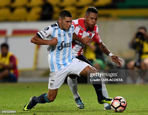 Colombia's Junior player James Sanchez vies for the ball with Argentina's Atletico Tucuman player David Barbona during their Copa Libertadores 2017...