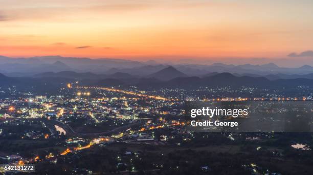 mountains and the lights from the city. - high level summit stock pictures, royalty-free photos & images