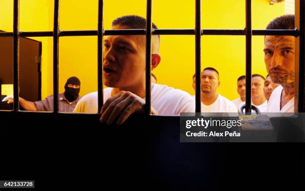 Prisoner, member of the "Barrio 18 Revolucionarios" gang speaks at the San Francisco Gotera Prison on February 16, 2017 in Morazan, El Salvador. The...