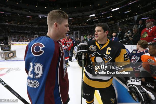 Nathan MacKinnon of the Colorado Avalanche and Sidney Crosby of the Pittsburgh Penguins talk near the bench during the 2017 Coors Light NHL All-Star...