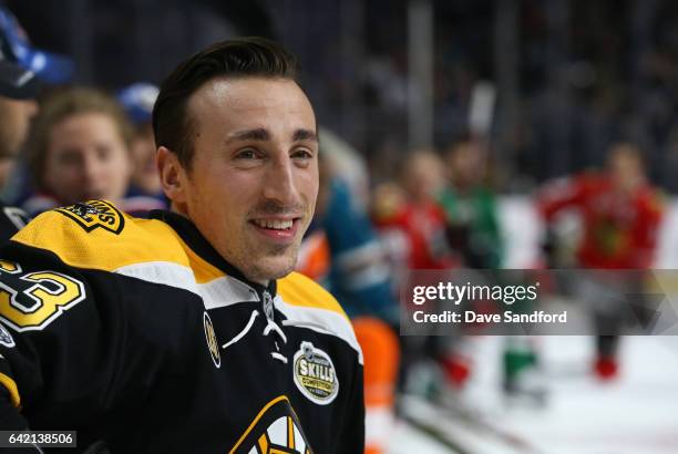 Brad Marchand of the Boston Bruins smiles from the side boards during the 2017 Coors Light NHL All-Star Skills Competition at Staples Center on...