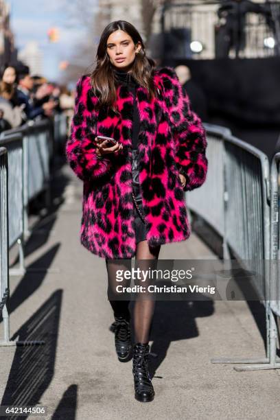 Model Sara Sampaio wearing a pink black leoprint coat outside Marc Jacobs on February 16, 2017 in New York City.