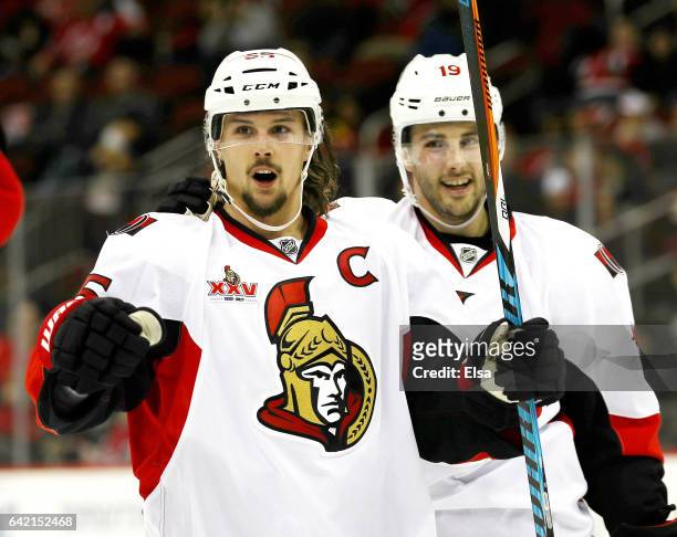 Erik Karlsson of the Ottawa Senators celebrates his goal as teammate Derick Brassard stands by in the third period against the New Jersey Devils on...