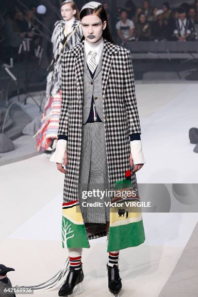 Model walks the runway at the Thom Browne Ready to Wear Fall Winter 2017-2018 fashion show during New York Fashion Week on February 15, 2017 in New...