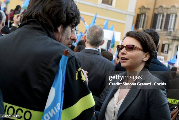 Maria Edera Spadoni, member of the Movement 5 Star talks with the firefighters in uniform came from all over Italy and demonstrate in front of...