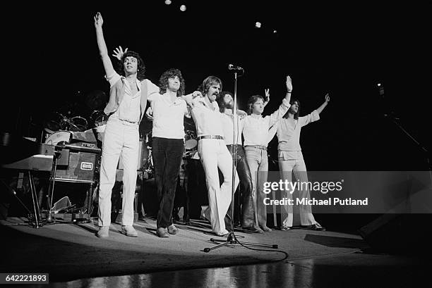 English rock band 10cc on stage at a concert on their world tour, USA, November 1978. Left to right: Graham Gouldman, Stuart Tosh, Rick Fenn, Kevin...