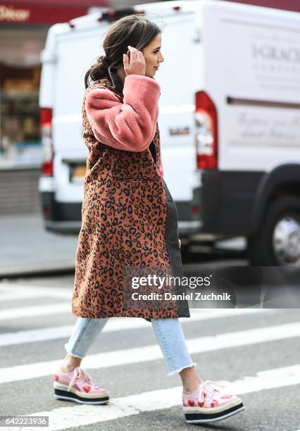 Guest is seen wearing a part animal print coat outside the Marc Jacobs show during New York Fashion Week: Women's Fall/Winter 2017 on February 16,...